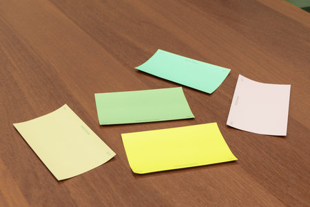 color picker cards with names lie on the table surface, selective focusの写真素材