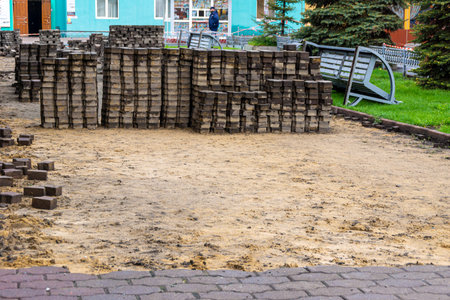 paving slabs removed from the surface for repair work or replacement of old tiles with new ones,...