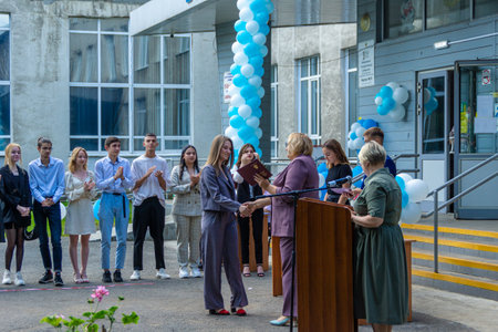 Russia, Kemerovo - 07, 2021. In the open air, young people are awarded graduation diplomas, selective focusのeditorial素材