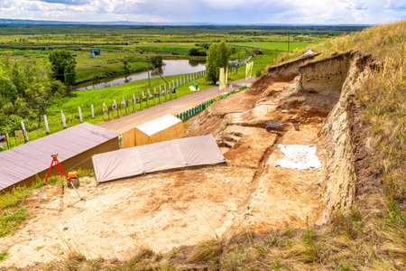 Russia, Kemerovo region, Shestakovo village - July 16, 2022. View from observation deck of the site of paleontological or archaeological work Shestakovo-3 near village of Shestakovo, selective focusのeditorial素材