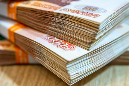 money in red 5000 bills lies on a light surface, selective focus and close-up