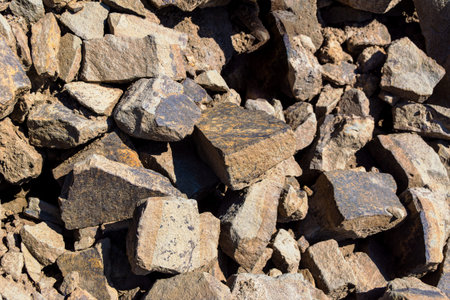 Raw aggregate material with varied color and sharp edges suitable for foundation or road base...