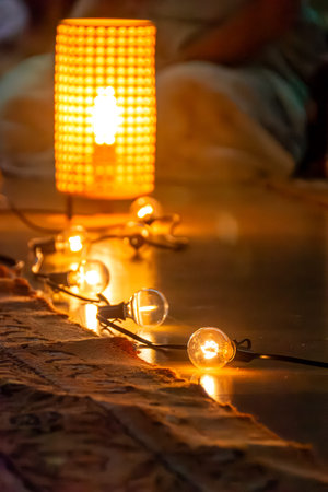 Symbolic representation of warmth through ambient lighting and soft focus. Blurred figure evokes a...