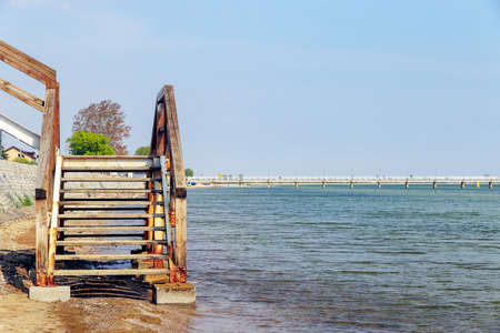 Stairs by the sea leading from the beach to the promenade in Mechelinki, Polandの写真素材