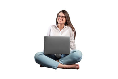 smiling girl working on a laptopの写真素材