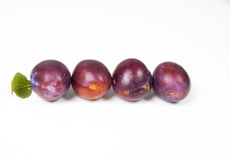 Plums On White