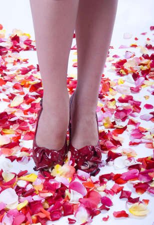 High Heels Over Supernatural Rose Petals Backgroundの写真素材