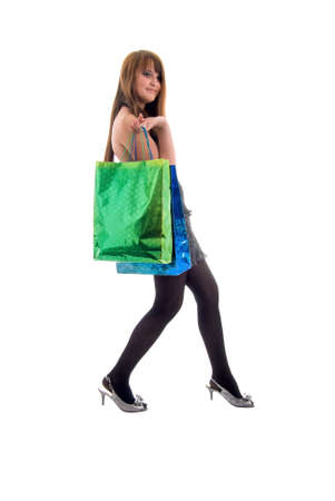 Girl and Shopping Bags. Isolated On White Backgrounds.の写真素材