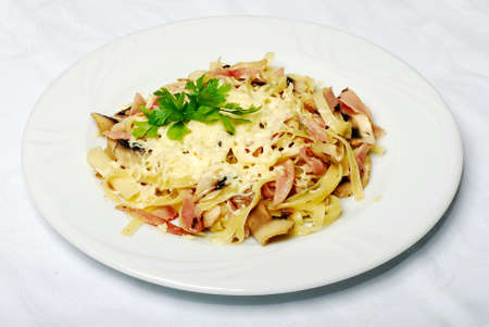 Pasta With Bacon And Parsley On White Tableの写真素材