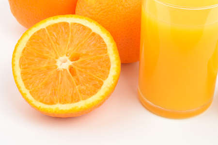 Oranges and glass of orange juiceの写真素材