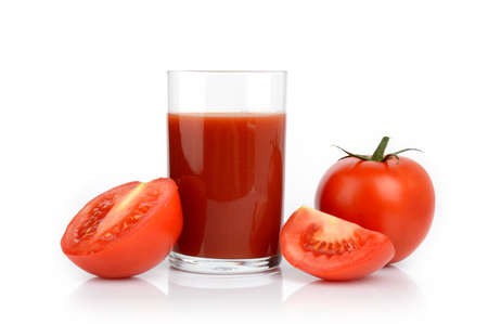 Few sliced tomatoes and a glass of tomato juice isolated on whiteの写真素材