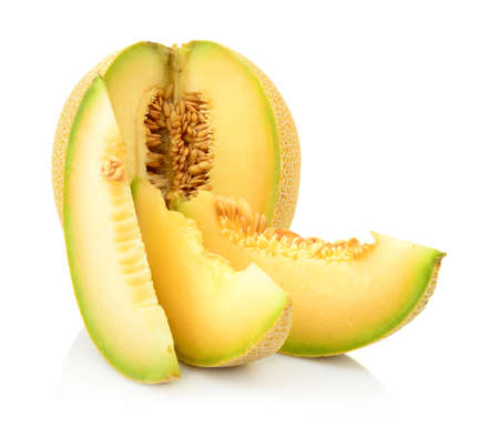 Studio shot of notched ripe melon galia with slices isolated on white backgroundの写真素材