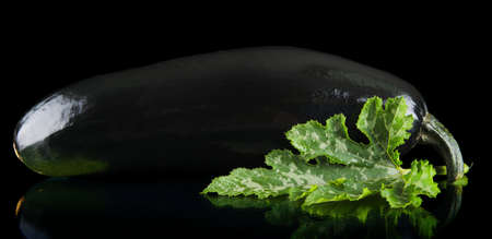 Close-up photo of zucchini on black backgroundの写真素材