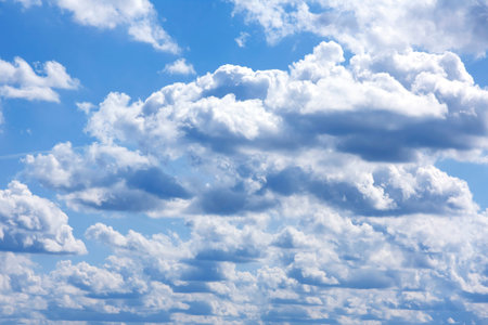 Blue sky background with white cloudsの写真素材