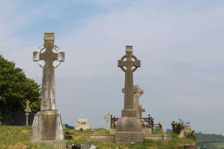 Two old Celtic Crosses in graveyard blue clear sky Ireland Timoleague or could be anywhere in Irelandの写真素材