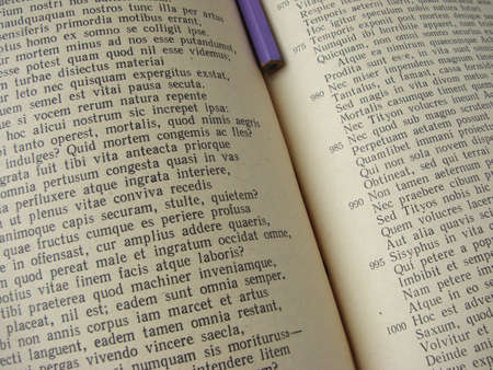  fragment of the opened book with a pencilの写真素材