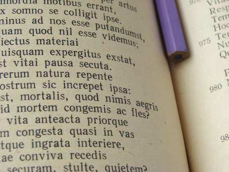 fragment of the opened book with a pencilの写真素材