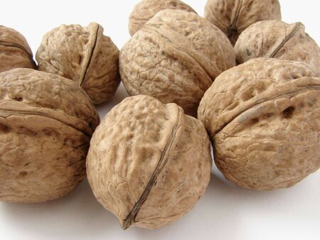  several walnuts on the light backgroundの写真素材