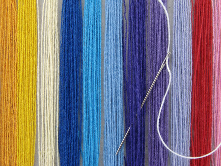 set of the multicolored threads for needlework as a background                               