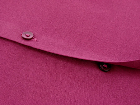 purple blouse fragment with buttons as a background                               