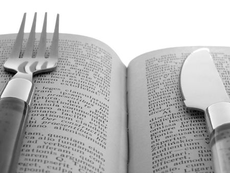 fork and knife with book (education metaphor)                               の写真素材