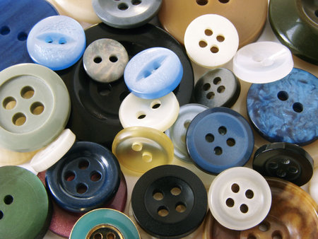 scattered colorful buttons needlecraft background                               