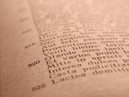 old book page with ancient Latin poem fragment  ( Virgil's Georgicon )                               の写真素材