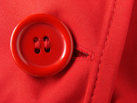 red clothes fragment with button                               