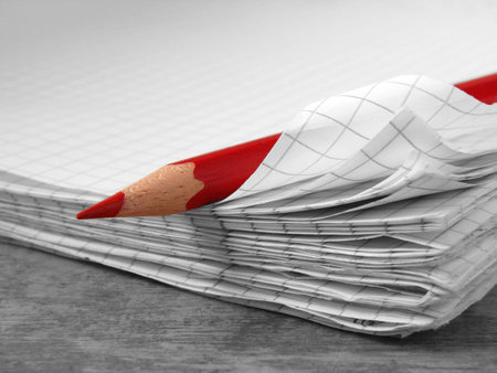red pencil and old notebook 