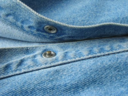 denim clothes fragment with button                               の写真素材