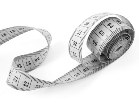 curved measuring tape fragment on white                               