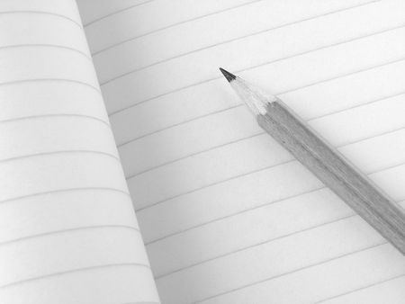 pencil and open workbook fragment in black and white                               の写真素材
