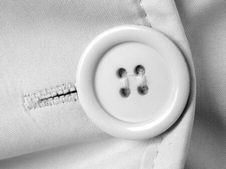 clothes fragment with button in black and white                          の写真素材