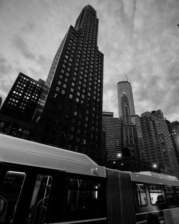 A city bus in front of the Union Carbide Buildingの写真素材