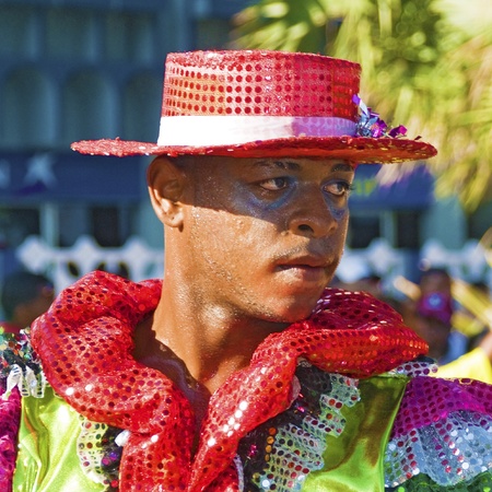 SANTO DOMINGO, DOMINICAN REPUBLIC - MARCH 6: Carnival dancer wearing exotic customs stares at public while sweating at the "Malecon" Carnival on March 6, 2011 in Santo Domingo, Dominican Republic.のeditorial素材