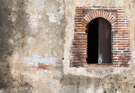 Fortress Window with Textured Wall Space on Left Side の写真素材