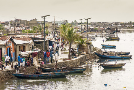 CAP-HAITIEN, HAITI - NOV 17, Unidentified people on their daily life by Mapou river after the devastation and poverty left in part by the 2010 earthquake on November 17, 2013 in Cap-Haitien, Haiti のeditorial素材