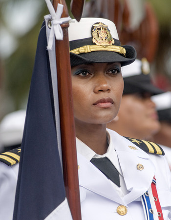 SANTO DOMINGO, DOMINICAN REPUBLIC - FEBRUARY 27  Military woman in uniform holding flag at the Independence Military Parade on February 27, 2014 in Santo Domingo, Dominican Republic  のeditorial素材