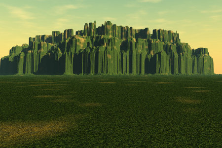 A meadow leading to a weathered mountainの写真素材