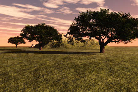 Colorful greens of trees and grass with a small hill in the background.の写真素材