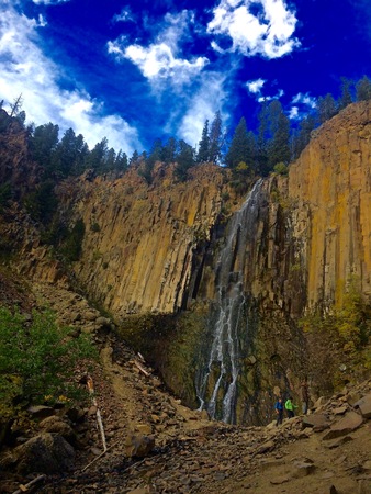 Hikers Walk Past Palisade Falls in Bozeman, Montanaの写真素材