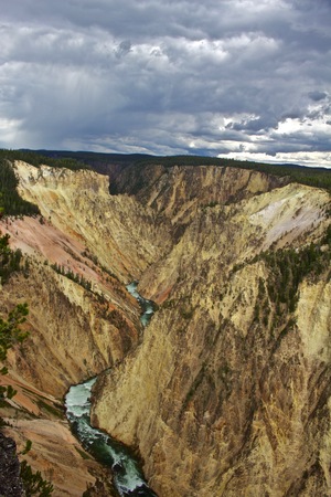 Grand Caynon of Yellowstone with Storm in the Distance, Yellowstone River and white cliffsの写真素材