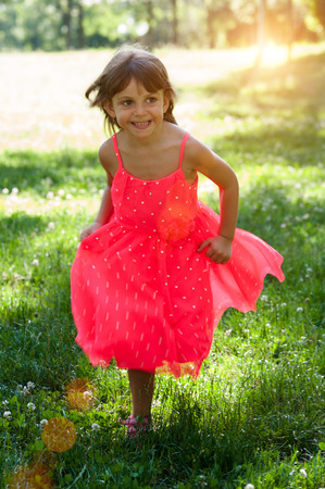 Little girl in the gardenの写真素材