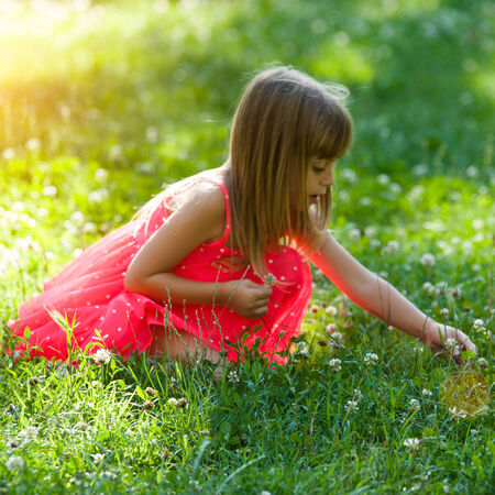 Little girl in the gardenの写真素材