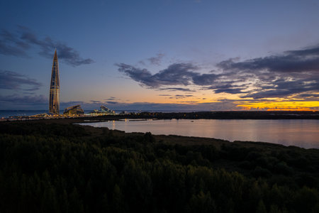 avenue park view of the skyscraper in the evening purple sunset lakhta centerの写真素材