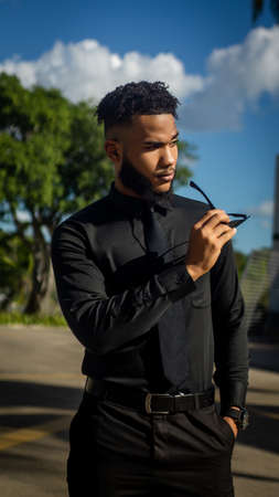 man leaves his job and goes for a walk in the park and enjoys his walkの写真素材