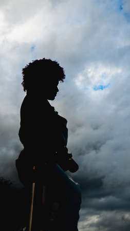 Girl who is dedicated to photography prepares from home to go to take photos of nature.の写真素材