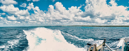 boats sailing in the sea towards the horizonの写真素材