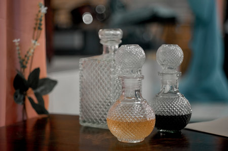 Bottle of perfume on a table in the interior of the roomの写真素材