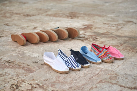 Children's shoes on the floor. Selective focus and small depth of field.の写真素材